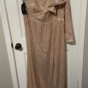 Elegant gold sequined formal. Never worn and with tags.